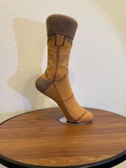 The camel boot sock from the side, showing the seam lines down the vamp.