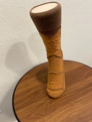 Back view showing the ribbed brown cuff and the notched boot top.