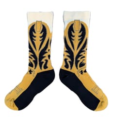 A pair of mustard and black cowboy boot socks standing upright against a white background.